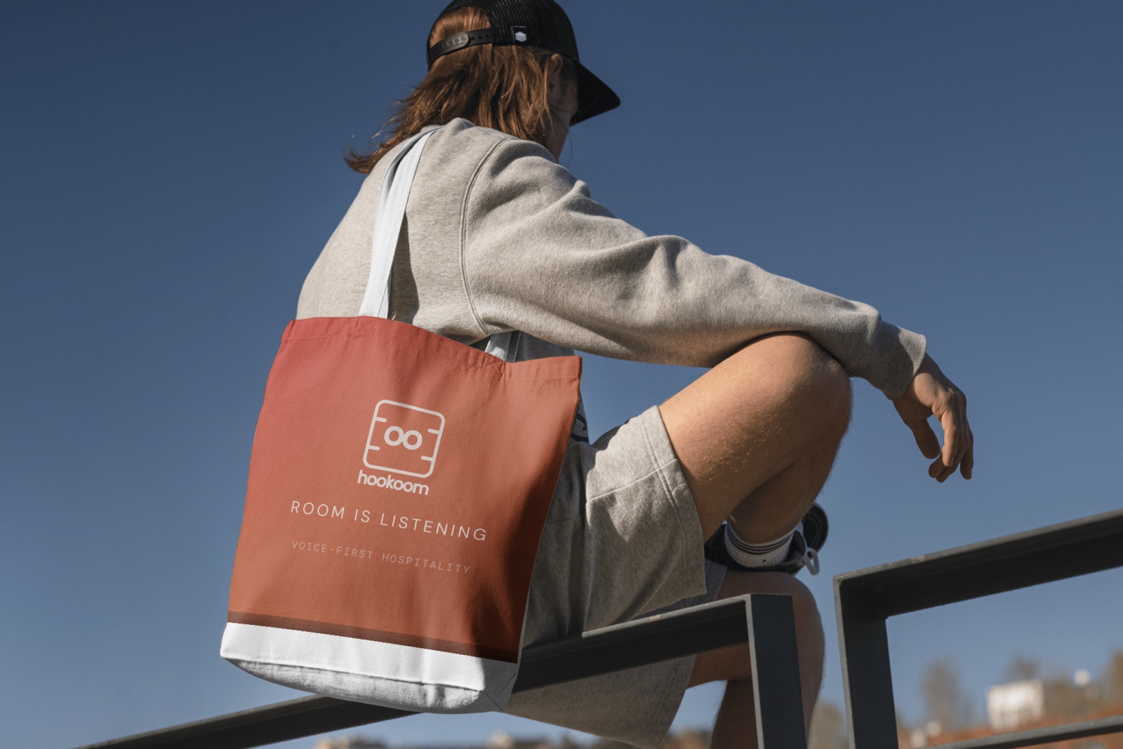 Hookoom brand tote bag reading Room is listening, voice-first hospitality
